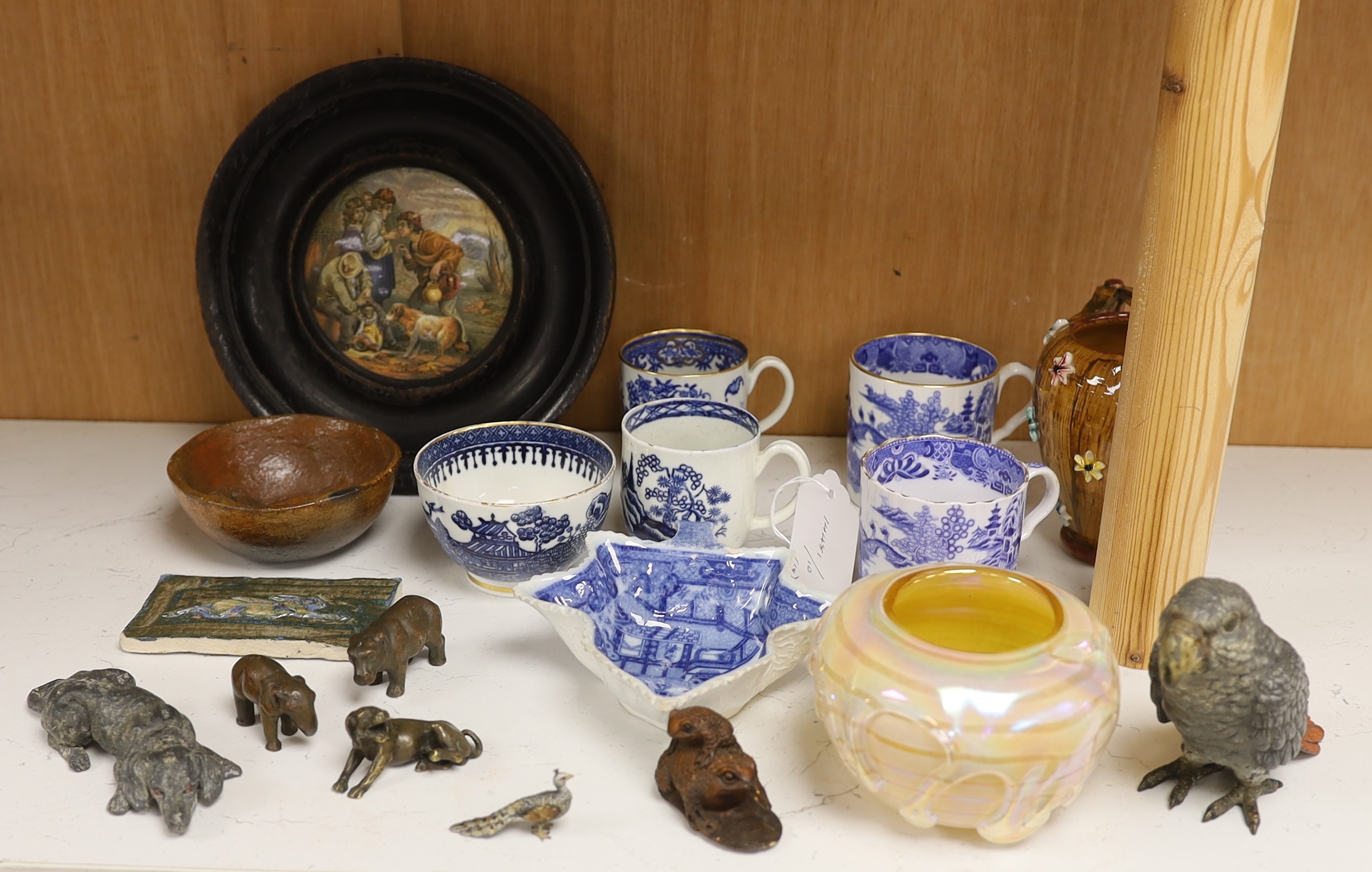 An early 20th century Viennese cold painted bronze figure of an African grey parrot, two 18th century English coffee cups, a leaf shape pickle dish, Victorian pot lid, other metal animal figures, a Japanese small carved
